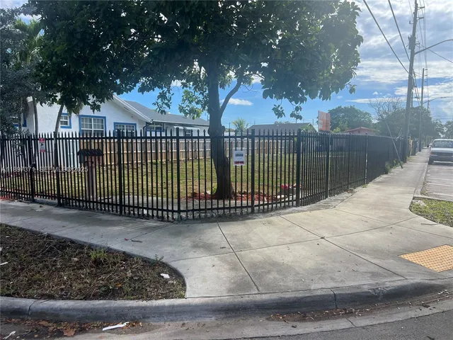 a view of a wrought iron fences in front of house