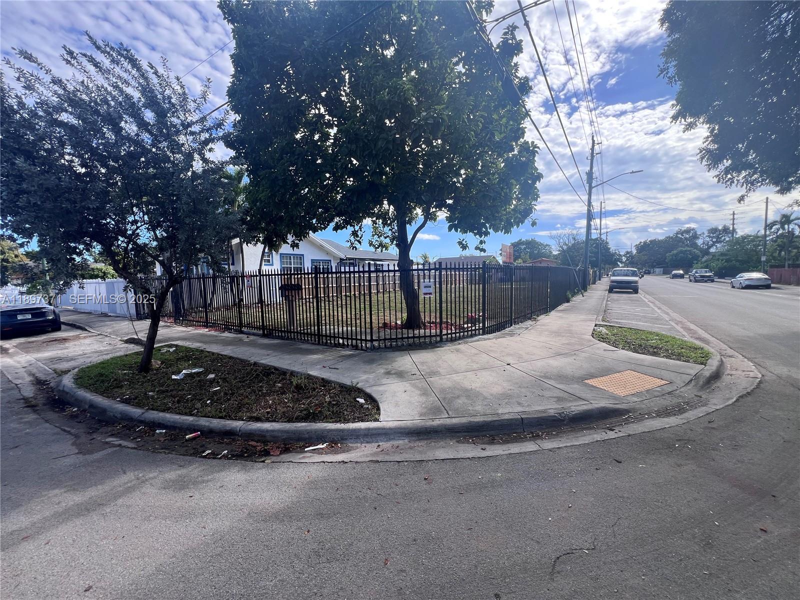 2052 Northwest 27th Street Miami, FL 33142 - Photo 7 of 14 a view of a park with large trees