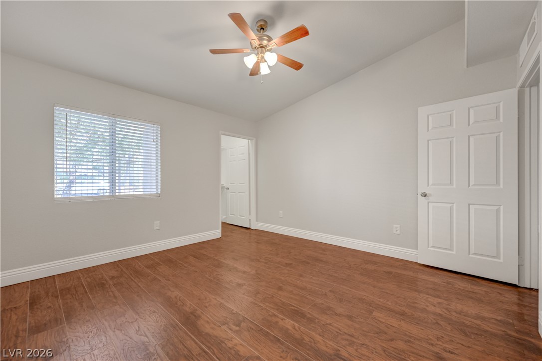 7885 West Flamingo Road, Unit 1050 Las Vegas, NV 89147 - Photo 23 of 62 Hardwood floors and a bright window create an inviting atmosphere in this versatile space.