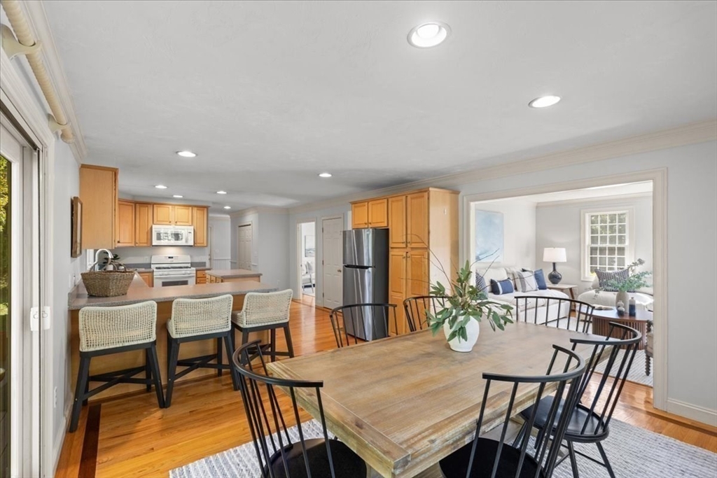 8 Trudys Lane Scituate, MA 02066 - Photo 14 of 41 a view of a dining room with furniture and a table and kitchen view