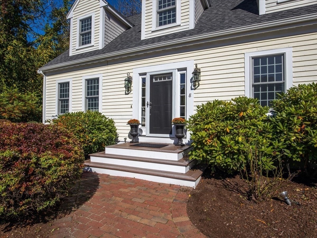 8 Trudys Lane Scituate, MA 02066 - Photo 2 of 41 a view of a house with potted plants and a bench