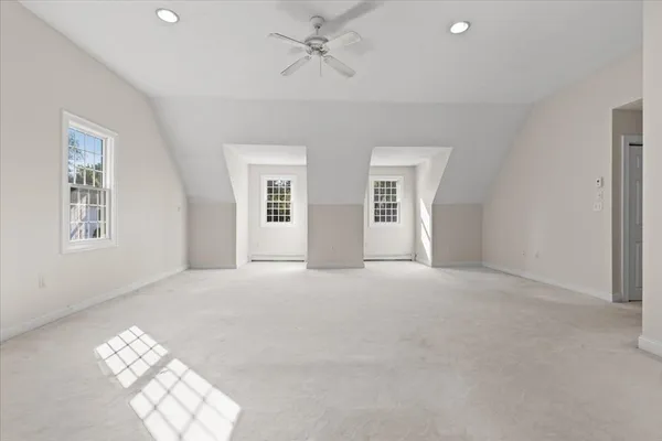 a view of an empty room with windows