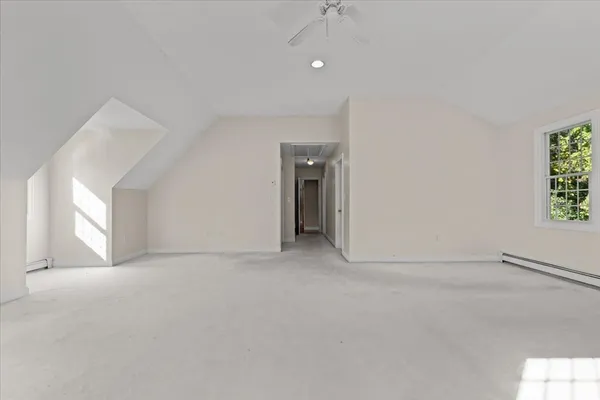 a view of an empty room and a window