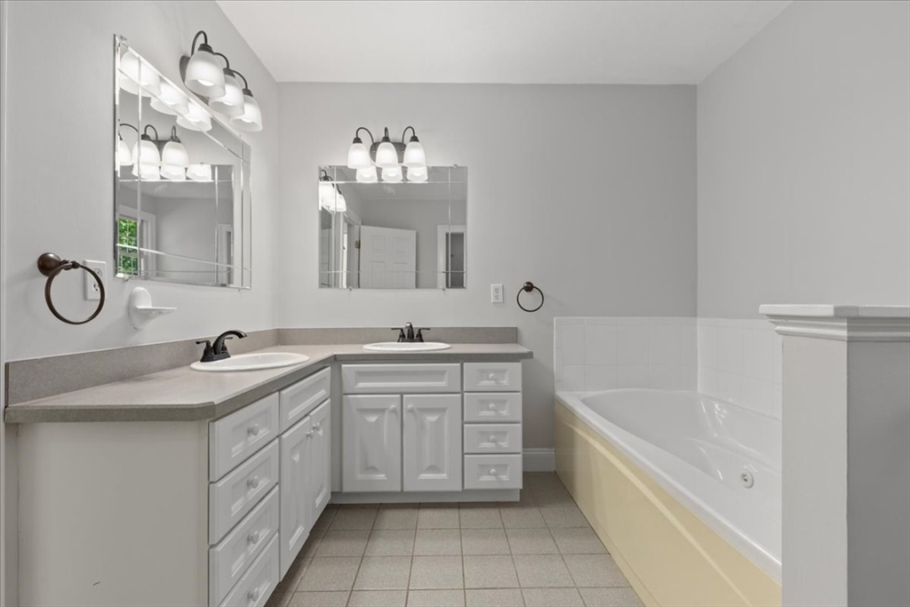 8 Trudys Lane Scituate, MA 02066 - Photo 26 of 41 a bathroom with a tub sink and mirror