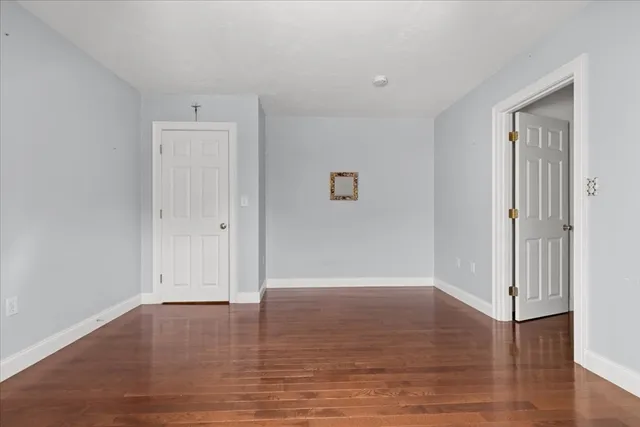 a view of wooden floor in an empty room