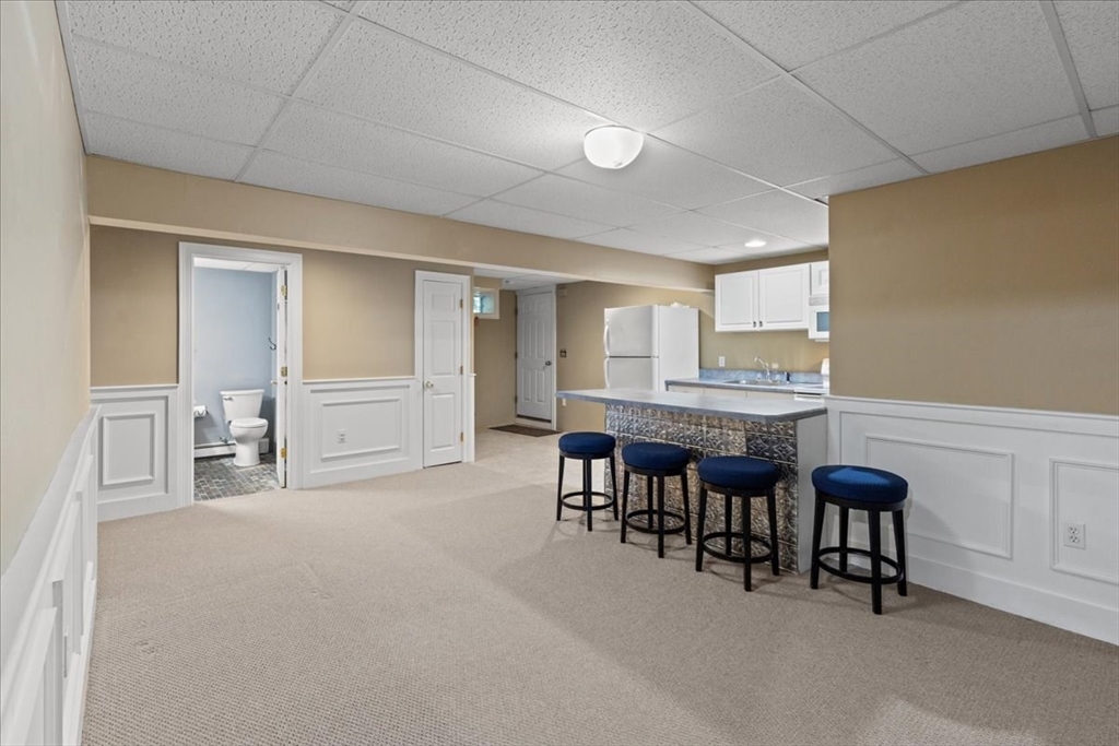 8 Trudys Lane Scituate, MA 02066 - Photo 31 of 41 a room with furniture and a table