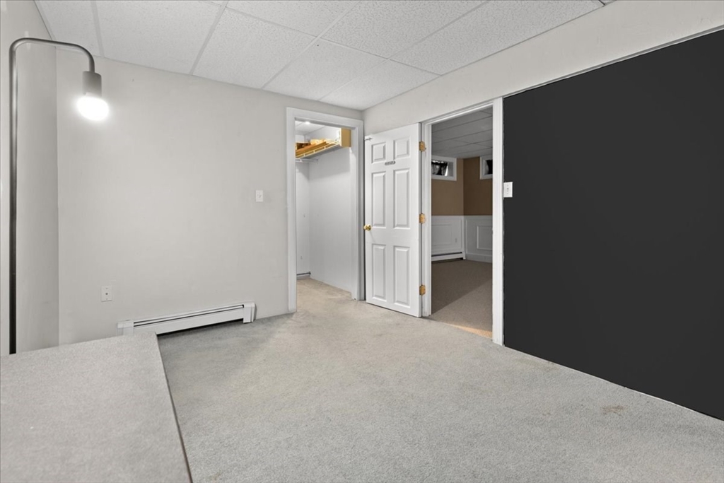 8 Trudys Lane Scituate, MA 02066 - Photo 37 of 41 an empty room with closet and mirror