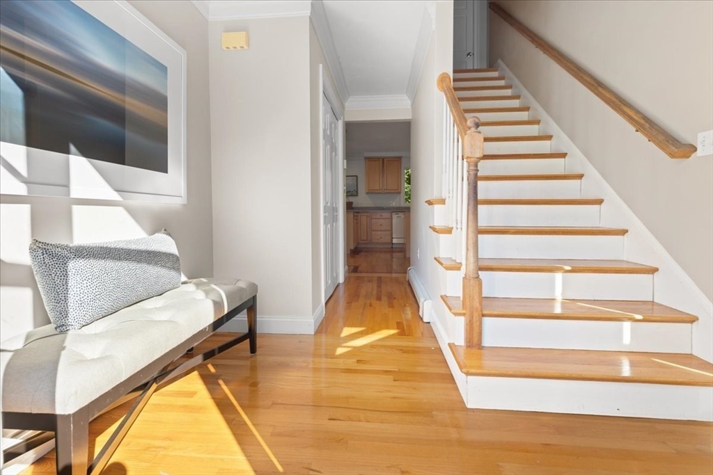 8 Trudys Lane Scituate, MA 02066 - Photo 6 of 41 a view of entryway and hall with wooden floor