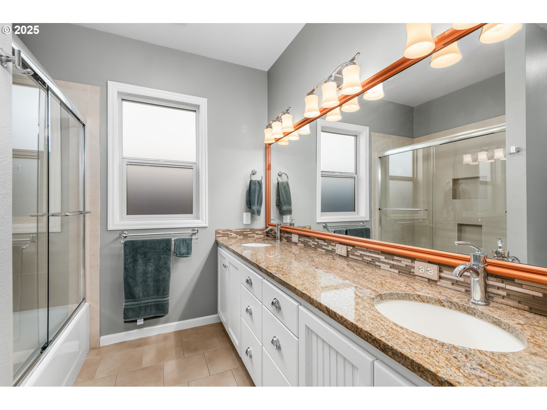 2053 Lakeview Drive Eugene, OR 97408 - Photo 16 of 45 a bathroom with a granite countertop double vanity sink and mirror