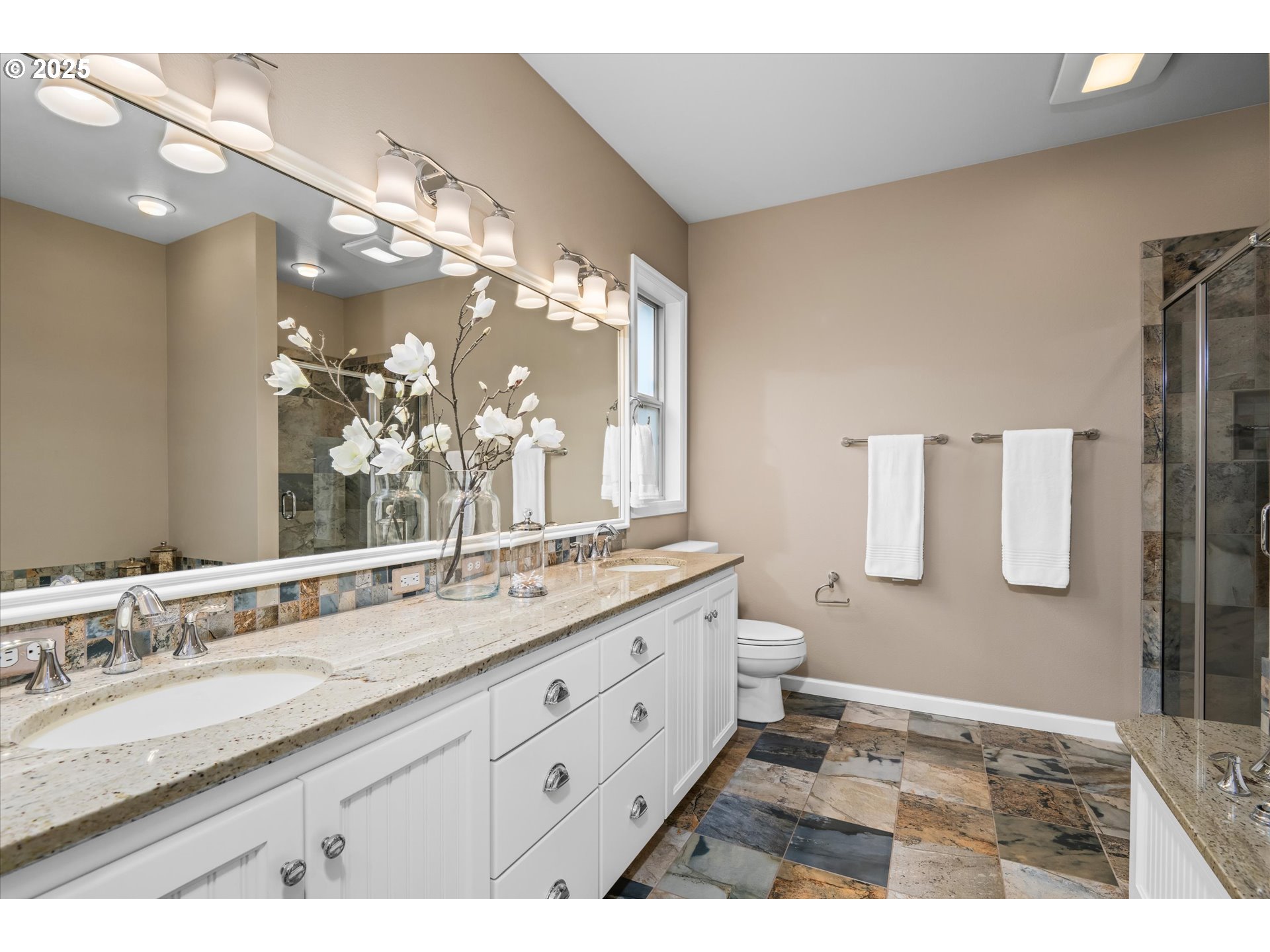 2053 Lakeview Drive Eugene, OR 97408 - Photo 27 of 45 a bathroom with a granite countertop sink a toilet a mirror and shower