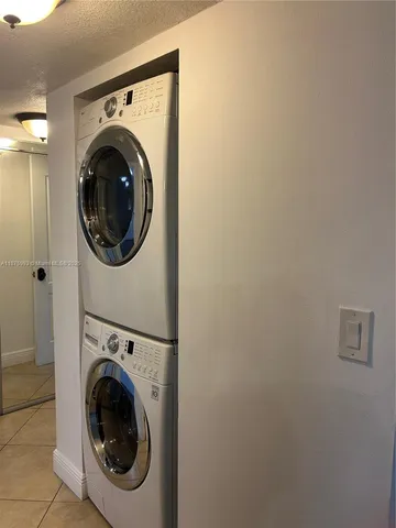 a view of a hallway with washer and dryer