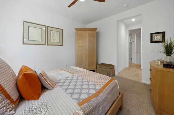 a bedroom with bed and a couch