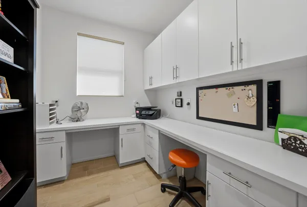 a kitchen with a sink cabinets and window