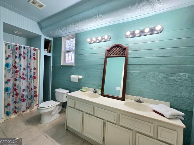 a room with furniture and pool table