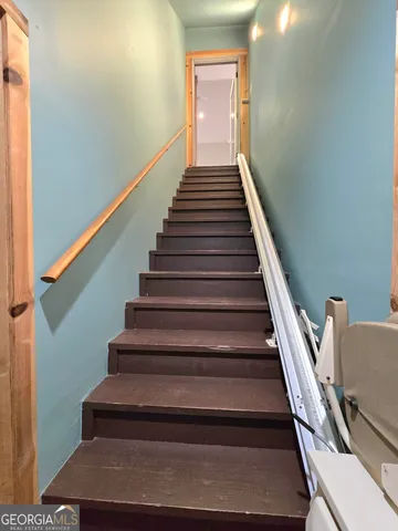 a spacious bathroom with a mirror a sink and a mirror