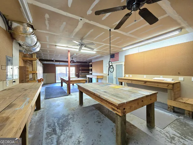 a kitchen with a table and chairs in it
