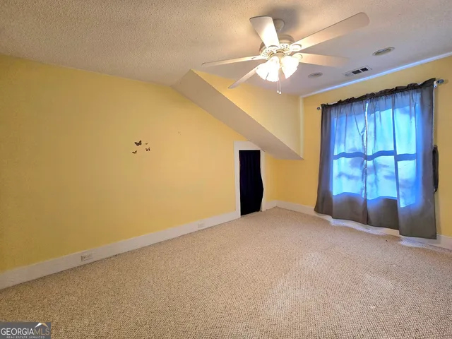 a view of storage and utility room with washer and dryer