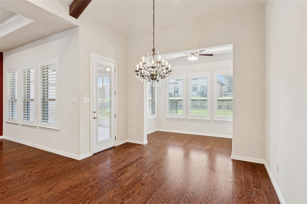 2104 Ladera Way, Unit 2104 Mansfield, TX 76063 - Photo 13 of 27 a view of a room with wooden floor and windows