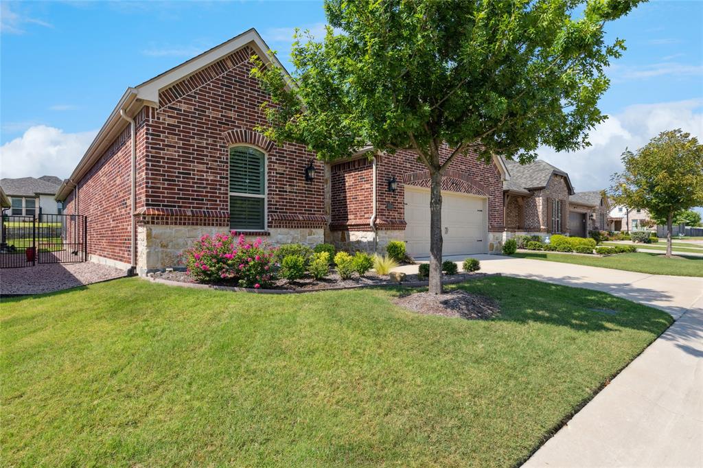 2104 Ladera Way, Unit 2104 Mansfield, TX 76063 - Photo 2 of 27 a front view of house with yard and green space