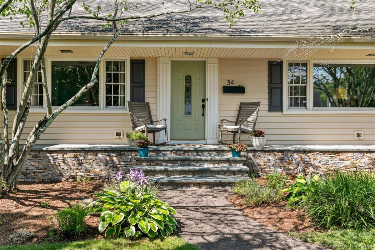 34 Ranch Road Hamden, CT 06517 - Photo 1 of 1 front view of house with a bench