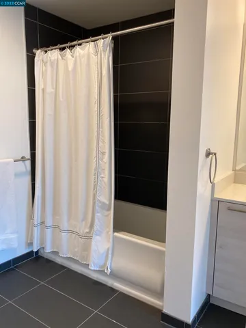 a bathroom with a shower and a tub