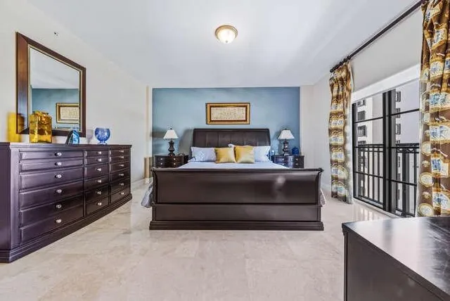 a bedroom with a bed and a dresser