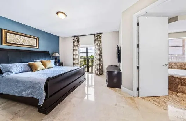 a bedroom with a bed and a walk in closet