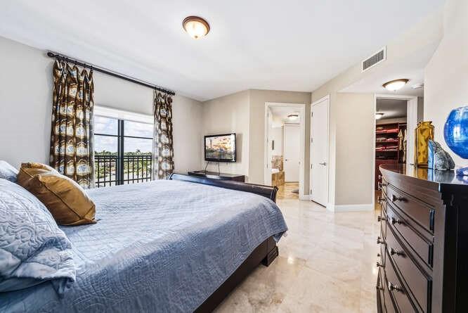2401 North Ocean Boulevard, Unit 500 Fort Lauderdale, FL 33305 - Photo 15 of 38 a bedroom with a bed and a large window