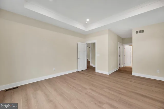 a bathroom with a granite countertop sink a mirror a shower and a bathtub