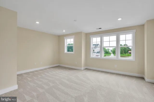 a bathroom with a double vanity sink toilet and a mirror