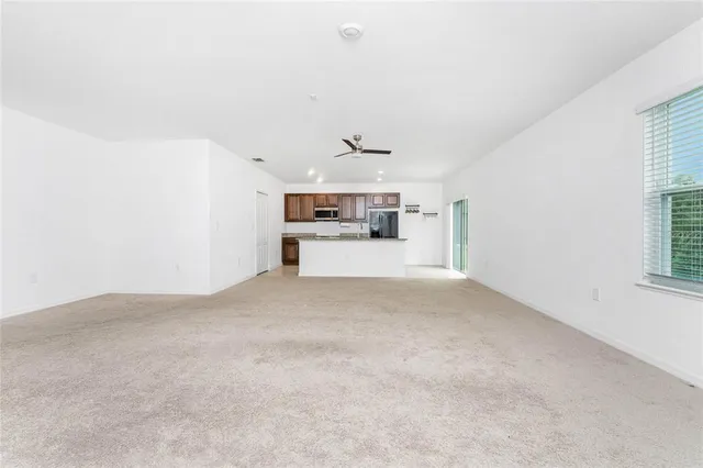 a kitchen with stainless steel appliances a refrigerator sink and stove