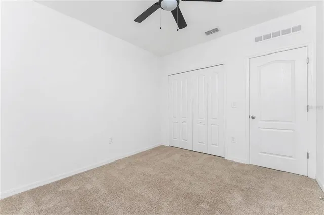 a white toilet sitting next to a bath tub