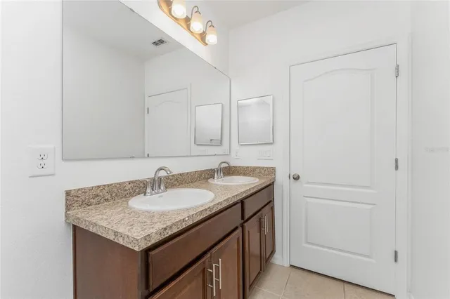 a view of a room with a ceiling fan