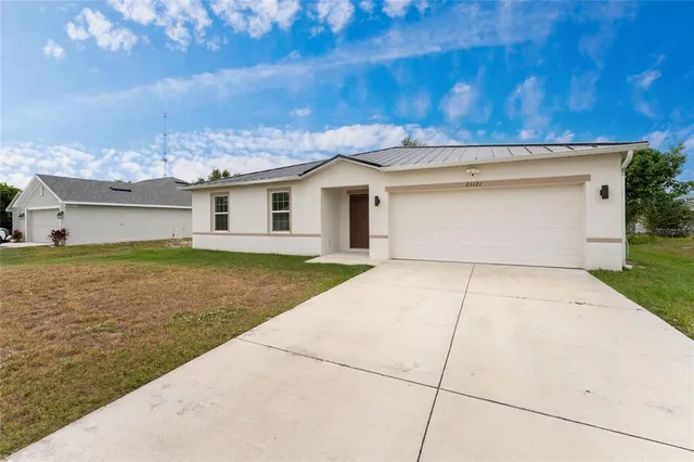 an aerial view of a house with a garden