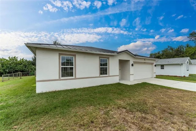 an aerial view of a house with a garden
