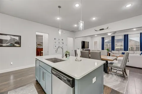 a kitchen with a sink a counter top space and appliances