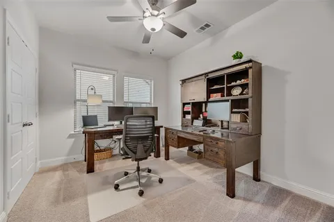 a view of a workspace with furniture