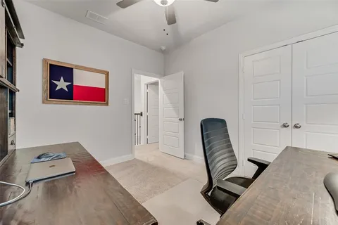 a hallway with a couch and a potted plant