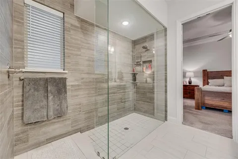 a bathroom with a shower and a sink