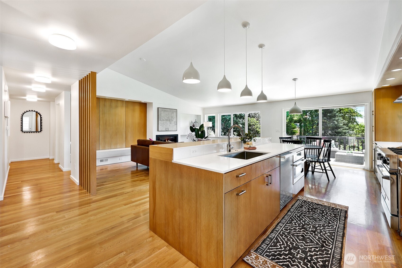 2547 Northeast 83rd Street Seattle, WA 98115 - Photo 10 of 38 a kitchen with a stove and cabinets