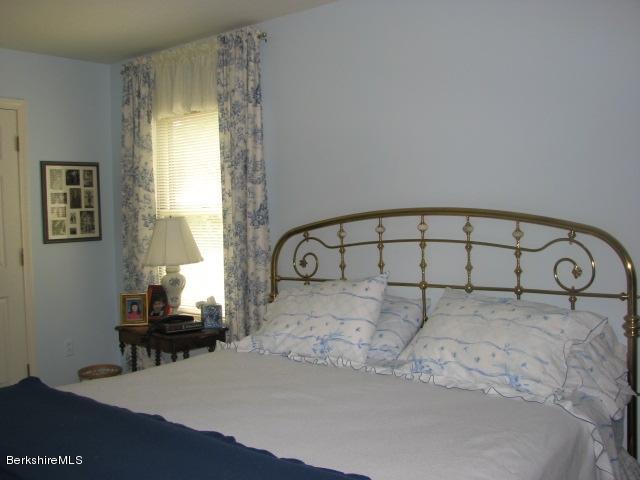 16 Hill Road Stockbridge, MA 01266 - Photo 12 of 20 a bedroom with a bed and a window
