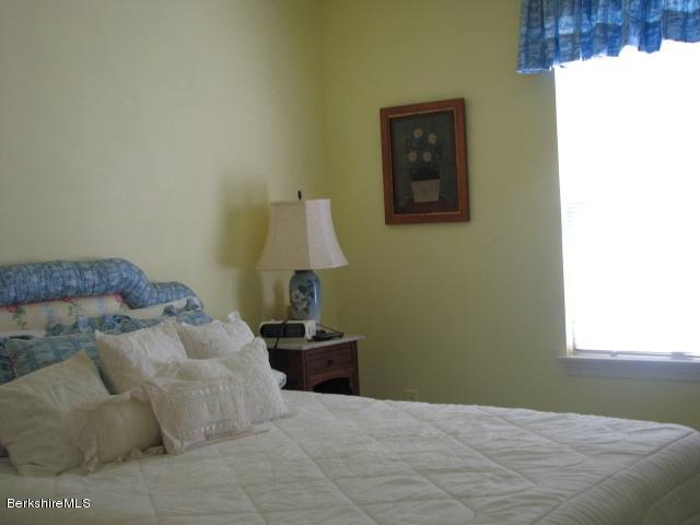 16 Hill Road Stockbridge, MA 01266 - Photo 15 of 20 a bedroom with a bed and a window