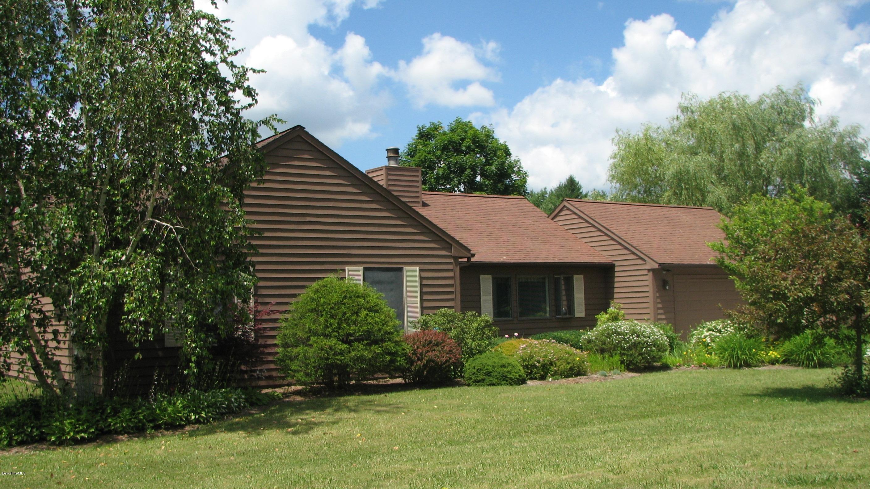 16 Hill Road Stockbridge, MA 01266 - Photo 20 of 20 a house that has a tree in it