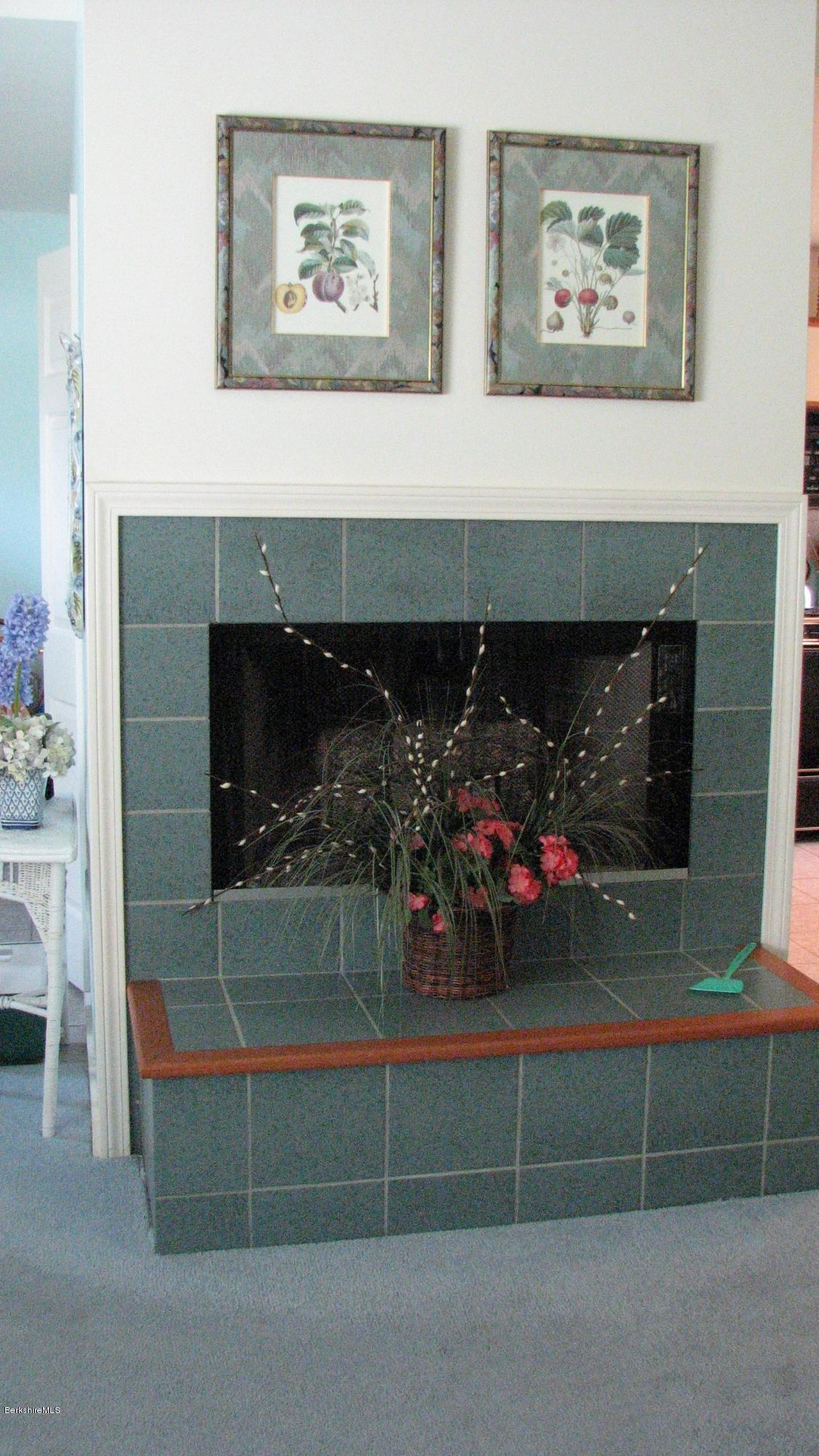 16 Hill Road Stockbridge, MA 01266 - Photo 6 of 20 a room with painting and a fireplace