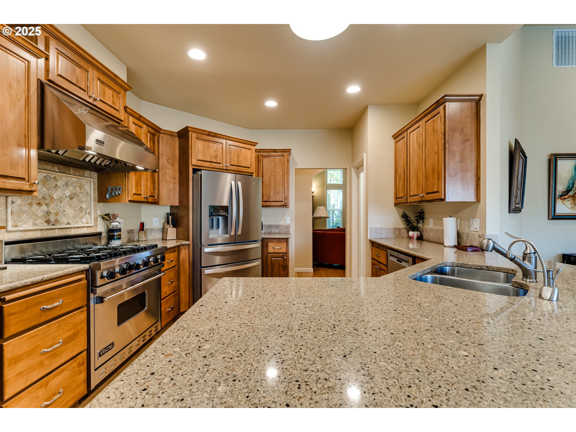 3351 Cape Hatteras Drive Eugene, OR 97408 - Photo 17 of 47 a kitchen with stainless steel appliances granite countertop a sink stove and refrigerator