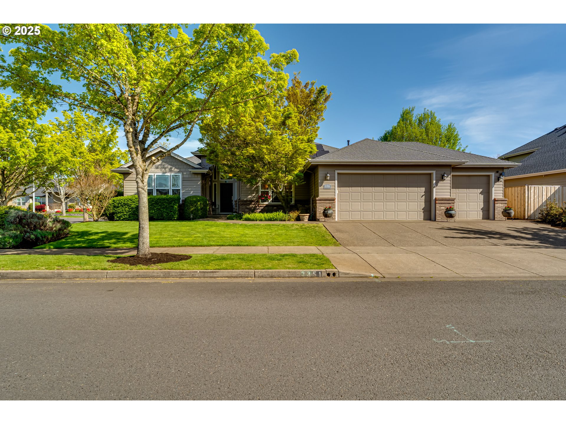 3351 Cape Hatteras Drive Eugene, OR 97408 - Photo 2 of 47 a view of a house with a big yard and large trees