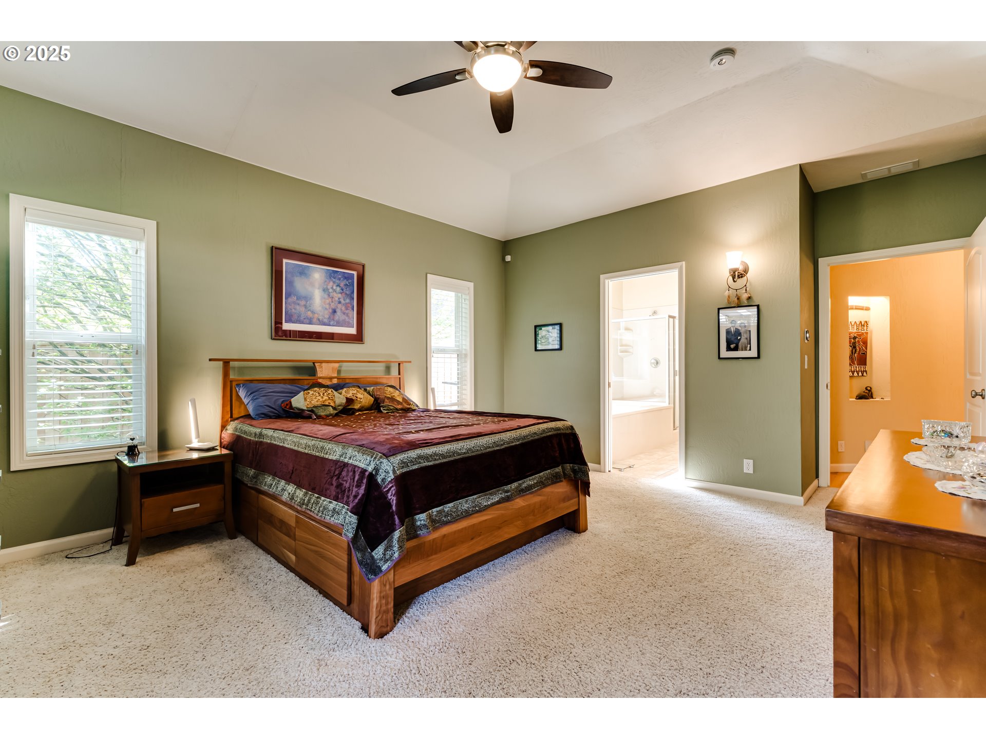 3351 Cape Hatteras Drive Eugene, OR 97408 - Photo 29 of 47 a spacious bedroom with a bed and a chandelier
