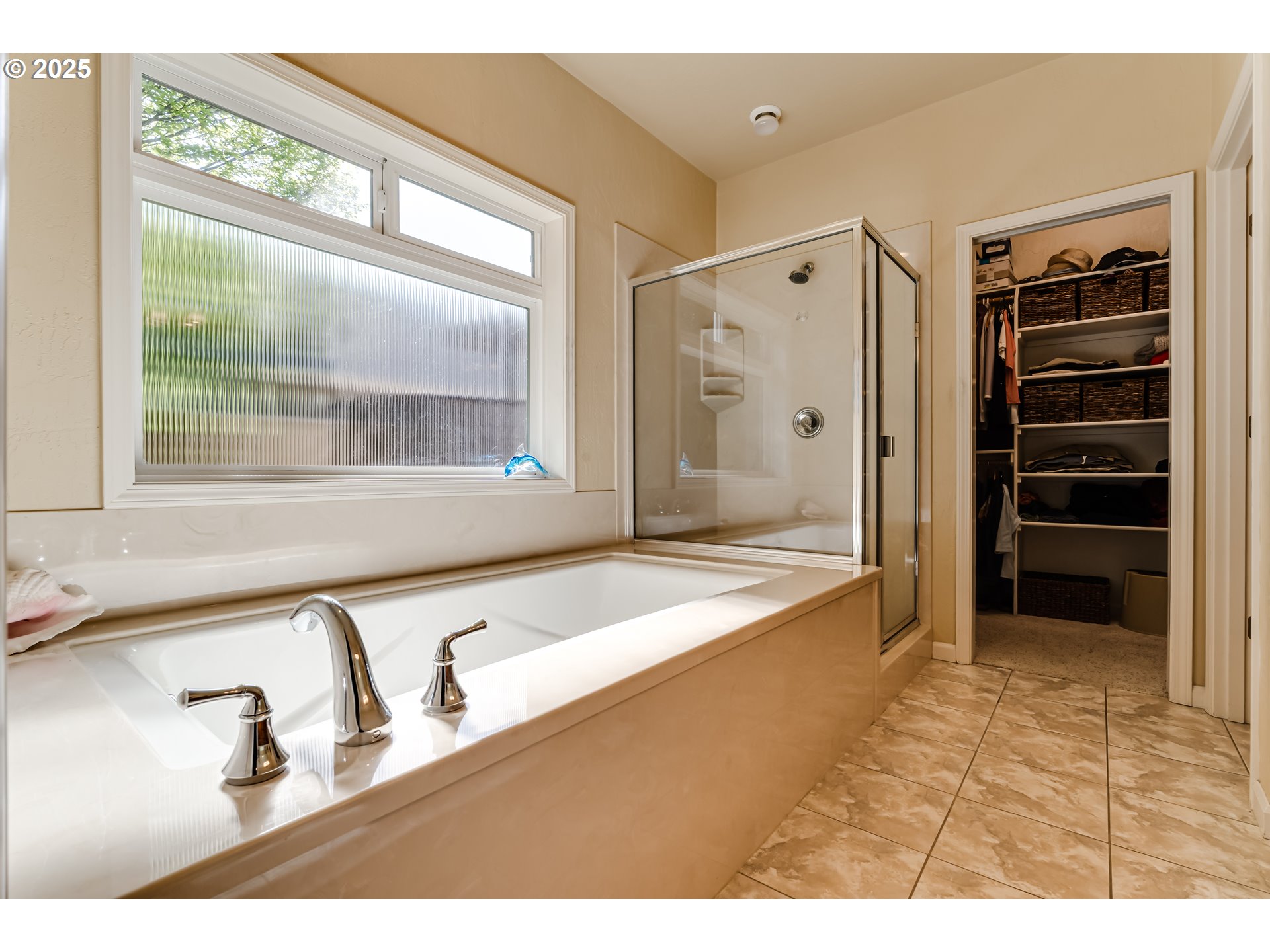 3351 Cape Hatteras Drive Eugene, OR 97408 - Photo 30 of 47 a bathroom with a tub a mirror and a sink