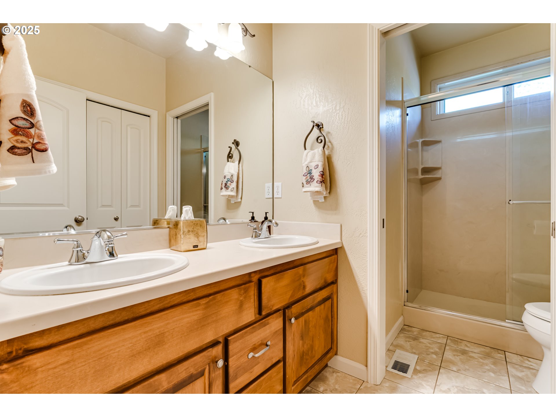 3351 Cape Hatteras Drive Eugene, OR 97408 - Photo 38 of 47 a bathroom with a sink a toilet and shower