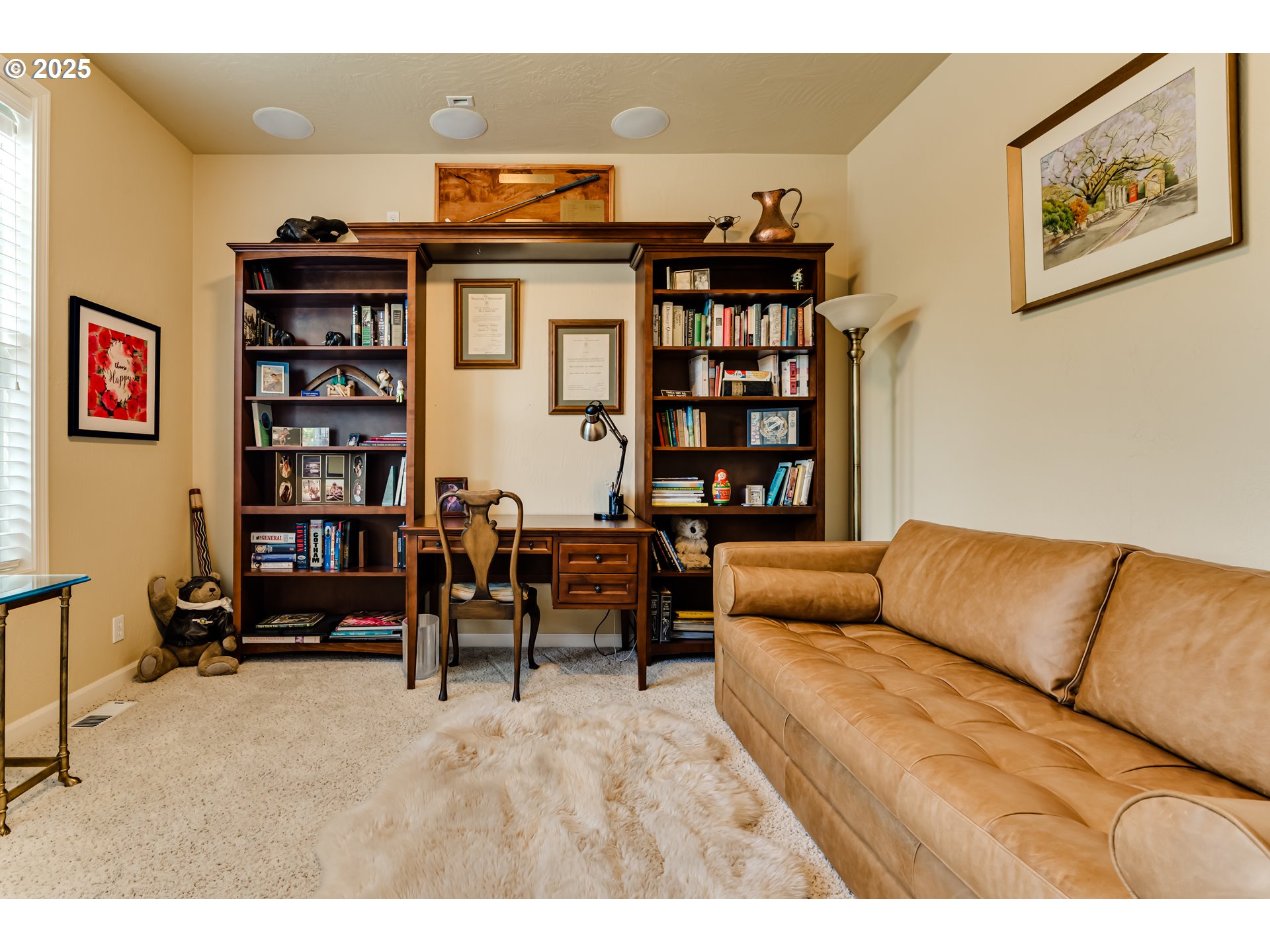 3351 Cape Hatteras Drive Eugene, OR 97408 - Photo 43 of 47 a living room with furniture a bookshelf and a book shelf